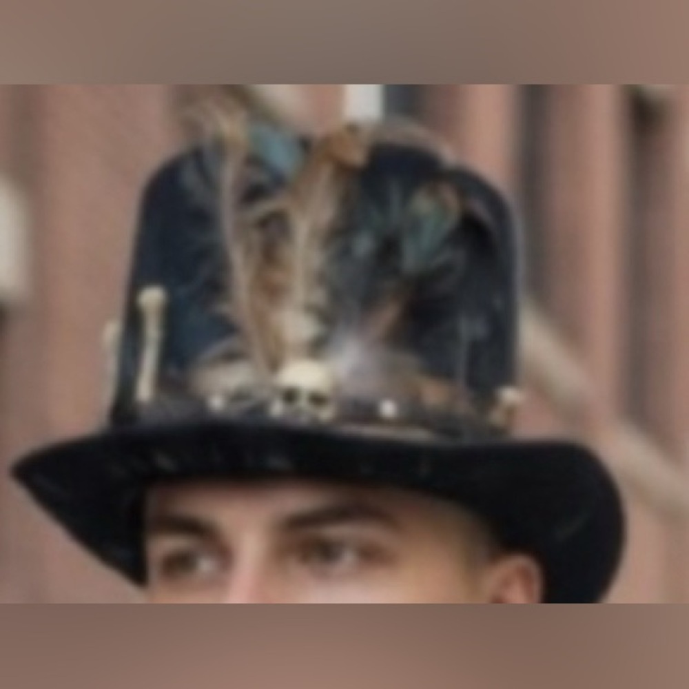 Spirit Steampunk Top hat with skull, bones, and feather features & worn out look